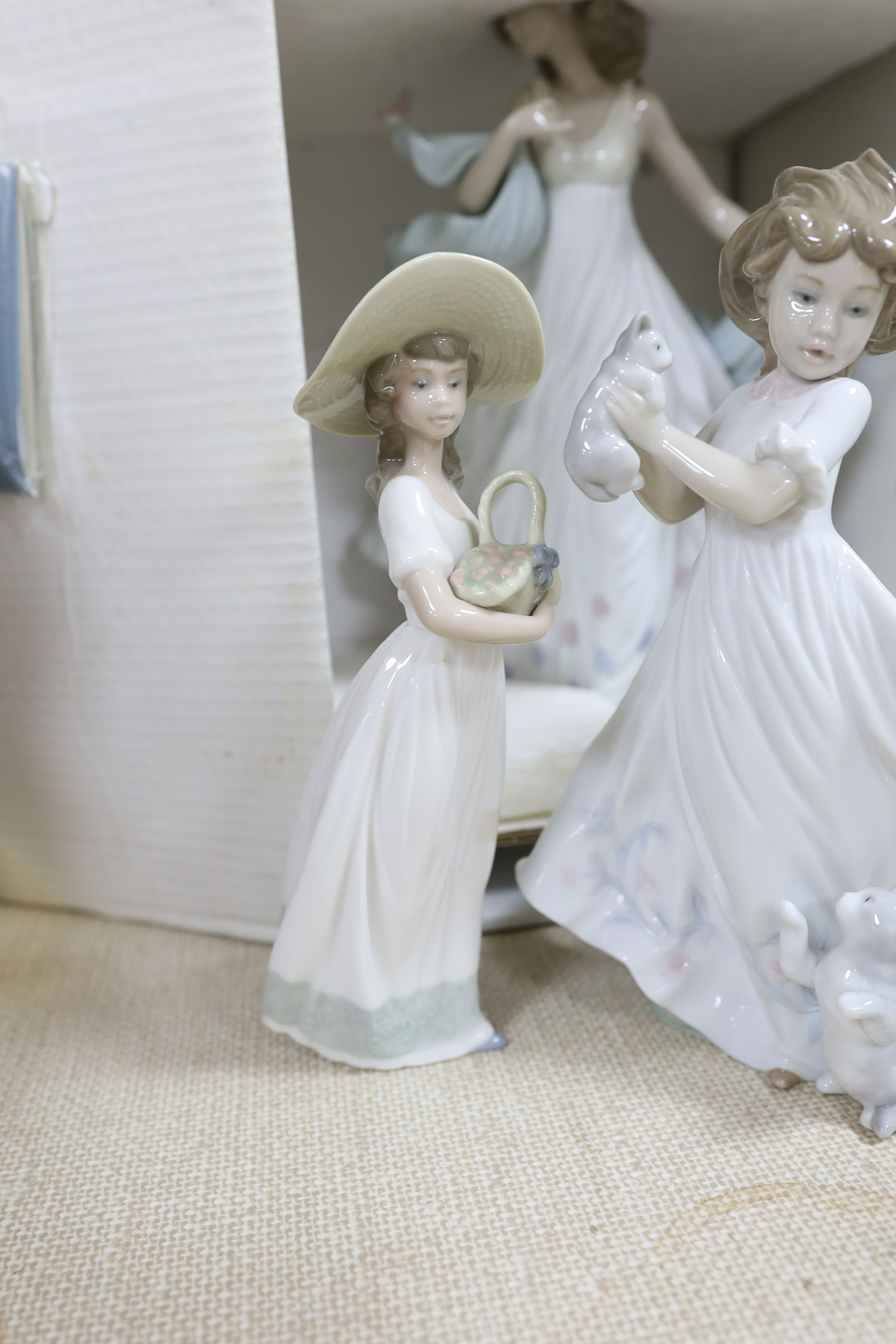 A selection of Lladro and Nao figures